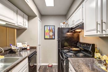 Fully Furnished Kitchen With Stainless Steel Appliances at 2400 Briarwest Apartments, Texas, 77077